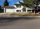 Charming two-story home with a two-car garage and a well-maintained front lawn at 9135 W Maplewood Ave, Littleton, CO 80123