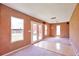 A spacious living room with double glass doors offers access to backyard and deck at 9135 W Maplewood Ave, Littleton, CO 80123