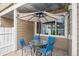 Outdoor patio with dining table and chairs, shielded by an umbrella for comfortable entertaining at 8095 E Colorado Ave # 5, Denver, CO 80231