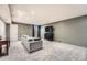 Spacious finished basement has carpet and a couch at 8095 E Colorado Ave # 5, Denver, CO 80231