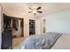 Bright bedroom with spacious closet featuring multiple storage shelves and white doors at 8095 E Colorado Ave # 5, Denver, CO 80231