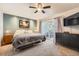 This bedroom features a sliding glass door, ceiling fan, and closet at 8095 E Colorado Ave # 5, Denver, CO 80231