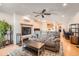 Open living room with fireplace, plush sofa, and a view into the kitchen area at 8095 E Colorado Ave # 5, Denver, CO 80231