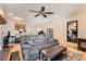 Bright living room with wood flooring, cozy couch, and a clear view into the kitchen area at 8095 E Colorado Ave # 5, Denver, CO 80231