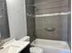 Updated bathroom with stylish tile, tub and shower combination at 10 S Nome St # E, Aurora, CO 80012