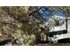 Charming home exterior with mature tree and beautiful landscaping at 10 S Nome St # E, Aurora, CO 80012