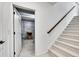 An open door reveals a basement with a staircase and a bare concrete floor at 6801 S Valleyhead Ct, Aurora, CO 80016