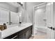 Elegant bathroom with a large mirror, dark wood vanity, and a separate toilet and shower area for added privacy at 6801 S Valleyhead Ct, Aurora, CO 80016