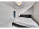 Serene bedroom with a modern platform bed, clean white linens, and minimalist decor, creating a calming space at 6801 S Valleyhead Ct, Aurora, CO 80016