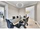 Elegant dining room featuring a modern chandelier and stylish furnishings, ideal for hosting gatherings at 6801 S Valleyhead Ct, Aurora, CO 80016