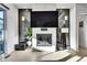 Modern fireplace with decorative tile surround, enhancing the space with a cozy and stylish focal point at 6801 S Valleyhead Ct, Aurora, CO 80016