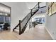 Spacious foyer with hardwood floors and a staircase leading to an upstairs living space, perfect for guests at 6801 S Valleyhead Ct, Aurora, CO 80016