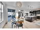 Bright kitchen features modern island, stainless steel appliances, and breakfast nook with backyard access at 6801 S Valleyhead Ct, Aurora, CO 80016