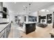 Open kitchen with a large center island, ideal for entertaining and connecting with the living space at 6801 S Valleyhead Ct, Aurora, CO 80016