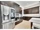 Chef's kitchen boasts high-end appliances, custom cabinets, and ample storage for culinary enthusiasts at 6801 S Valleyhead Ct, Aurora, CO 80016