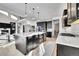 Gourmet kitchen featuring an island, modern appliances, pendant lighting, and ample counter space at 6801 S Valleyhead Ct, Aurora, CO 80016