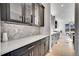 Modern kitchen showcasing sleek cabinetry, countertops, and a seamless flow to the dining area at 6801 S Valleyhead Ct, Aurora, CO 80016