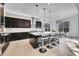 Sleek kitchen featuring stainless steel appliances, a large center island, and pendant lighting, perfect for cooking at 6801 S Valleyhead Ct, Aurora, CO 80016