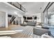 Stunning living room with an open floor plan and contemporary design elements, bathed in natural light at 6801 S Valleyhead Ct, Aurora, CO 80016