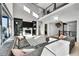 Bright living room with soaring ceilings, fireplace, and expansive windows allowing abundant natural light at 6801 S Valleyhead Ct, Aurora, CO 80016