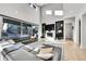 Sun-drenched living room with large windows and a stylish fireplace, perfect for relaxing and entertaining at 6801 S Valleyhead Ct, Aurora, CO 80016