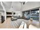 Open-concept living room seamlessly connects to the kitchen, creating a spacious and inviting atmosphere at 6801 S Valleyhead Ct, Aurora, CO 80016