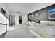 Large main bedroom offers a sitting area, natural light, and view of the ensuite bathroom at 6801 S Valleyhead Ct, Aurora, CO 80016