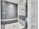 Modern bathroom features a glass-enclosed shower with built-in seat and dual shower heads at 6801 S Valleyhead Ct, Aurora, CO 80016