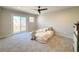 Bright bedroom with sliding glass door to deck and mountain views at 4865 S Taft St, Morrison, CO 80465