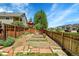 Backyard garden with raised beds and a wooden fence at 740 Boxwood Ln, Longmont, CO 80503