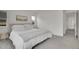 Comfortable bedroom boasts a queen bed with soft bedding, neutral decor, and an open doorway to the rest of the home at 740 Boxwood Ln, Longmont, CO 80503