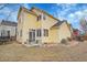 Charming yellow two-story home with a patio at 740 Boxwood Ln, Longmont, CO 80503