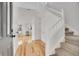 Bright foyer with hardwood floors and a staircase leading to the upper level at 740 Boxwood Ln, Longmont, CO 80503