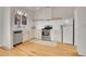 Bright kitchen features modern appliances, white cabinets, and a farmhouse sink at 740 Boxwood Ln, Longmont, CO 80503