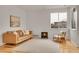 Bright living room with hardwood floors, modern finishes, and lots of natural light at 740 Boxwood Ln, Longmont, CO 80503