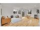 Bright living room with hardwood floors, large windows, and modern finishes at 740 Boxwood Ln, Longmont, CO 80503