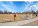 A beautiful park view featuring covered seating and reading library bench, perfect for relaxation and community engagement at 740 Boxwood Ln, Longmont, CO 80503