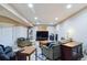 Spacious basement with large tv and comfortable seating at 15501 E 112Th Ave # 20C, Commerce City, CO 80022