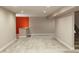 Open basement space with neutral walls and carpet at 15501 E 112Th Ave # 20C, Commerce City, CO 80022