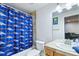 Bright bathroom featuring a shower and bathtub with decorative shower curtain at 15501 E 112Th Ave # 20C, Commerce City, CO 80022