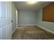 Cozy bedroom with neutral paint and carpet and a large window at 15501 E 112Th Ave # 20C, Commerce City, CO 80022