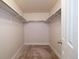 Walk-in closet with carpet and rod and shelf storage at 15501 E 112Th Ave # 20C, Commerce City, CO 80022