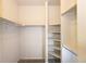 Walk-in closet space with shelving and racks, ready for organizing wardrobe items at 15501 E 112Th Ave # 20C, Commerce City, CO 80022