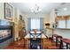 Dining room with a fireplace, hardwood floors and access to kitchen at 15501 E 112Th Ave # 20C, Commerce City, CO 80022