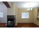 Cozy dining area with a fireplace, chandelier, and hardwood floors at 15501 E 112Th Ave # 20C, Commerce City, CO 80022