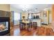 Dining room adjacent to the kitchen featuring modern lighting and hardwood floors at 15501 E 112Th Ave # 20C, Commerce City, CO 80022