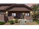 Charming front porch featuring stone pillars, decorative lighting, and a welcoming entrance at 15501 E 112Th Ave # 20C, Commerce City, CO 80022