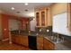 Open kitchen with breakfast bar, ample cabinetry, and hardwood floors at 15501 E 112Th Ave # 20C, Commerce City, CO 80022