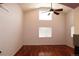 Bright living room with vaulted ceiling, hardwood floors, and ample natural light at 15501 E 112Th Ave # 20C, Commerce City, CO 80022