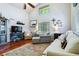 Cozy living room with vaulted ceilings, hardwood floors, and comfortable seating arrangements at 15501 E 112Th Ave # 20C, Commerce City, CO 80022